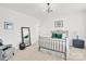 Bedroom with a full size bed, mirror, chair, and neutral colored walls and carpet at 3081 Montreaux Valley Dr, Fort Mill, SC 29707