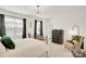 Bedroom with dark accents, an upholstered chair, and windows for lots of natural light at 3081 Montreaux Valley Dr, Fort Mill, SC 29707