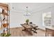 Spacious dining room featuring hardwood floors, wainscoting, and a modern chandelier at 3081 Montreaux Valley Dr, Fort Mill, SC 29707