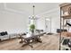 Inviting dining room with hardwood floors, wainscoting, a modern chandelier, and plenty of natural light at 3081 Montreaux Valley Dr, Fort Mill, SC 29707