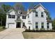 Charming two-story home with white siding, black shutters, and a well-manicured front lawn at 3081 Montreaux Valley Dr, Fort Mill, SC 29707