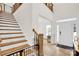 Grand foyer with hardwood floors, staircase, and plenty of natural light at 3081 Montreaux Valley Dr, Fort Mill, SC 29707