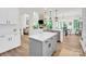 Modern kitchen with a center island, open layout, stainless steel appliances, and hardwood flooring at 3081 Montreaux Valley Dr, Fort Mill, SC 29707