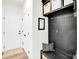 Functional mudroom with built-in bench, storage cubbies, and access to the front door at 3081 Montreaux Valley Dr, Fort Mill, SC 29707