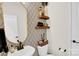 Stylish powder room with designer wallpaper, floating shelves, and modern fixtures at 3081 Montreaux Valley Dr, Fort Mill, SC 29707