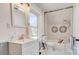 Well-lit bathroom with marble tile and modern fixtures at 310 S Poston St, Shelby, NC 28150