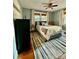 Cozy bedroom featuring a ceiling fan and a striped rug at 310 S Poston St, Shelby, NC 28150