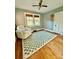 Bright bedroom with hardwood floors and a comfortable armchair at 310 S Poston St, Shelby, NC 28150