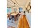 Open dining room with hardwood floors, decorative clock, stylish lighting, and view to living room at 310 S Poston St, Shelby, NC 28150