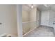Hallway with neutral carpet and a white banister at 310 S Poston St, Shelby, NC 28150