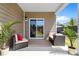 Comfortable covered patio with cushioned seating, a ceiling, and a sliding glass door to the interior at 3664 Mercer St, Terrell, NC 28682