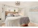 Cozy bedroom with wood floors, neutral walls, a chandelier, and natural light from two windows at 3713 Capricorn Rd, Lancaster, SC 29720