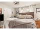 Bright bedroom featuring wood floors, a decorative chandelier, and natural light from two windows at 3713 Capricorn Rd, Lancaster, SC 29720