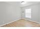 Small bedroom featuring wood floors, one window, and neutral colored walls at 3713 Capricorn Rd, Lancaster, SC 29720