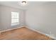 Small bedroom featuring wood floors, one window, and neutral colored walls at 3713 Capricorn Rd, Lancaster, SC 29720