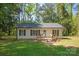 Charming single-story home with a cozy porch and a well-maintained front yard at 3713 Capricorn Rd, Lancaster, SC 29720
