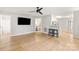 Bright living room features wood floors, ceiling fan, and an open layout to the kitchen and adjoining bedroom at 3713 Capricorn Rd, Lancaster, SC 29720