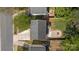 Aerial rooftop view of backyard featuring patio area with fire pit and driveway at 415 French St, Charlotte, NC 28216