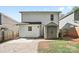 Backyard featuring a shed, patio, and privacy fence at 415 French St, Charlotte, NC 28216