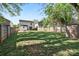 Expansive backyard with green grass, privacy fence, and storage shed at 415 French St, Charlotte, NC 28216