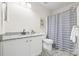 Bathroom featuring a granite countertop, framed mirror, and modern fixtures at 415 French St, Charlotte, NC 28216