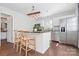 Modern kitchen with stainless steel appliances, granite countertops, and a butcher block island with seating at 415 French St, Charlotte, NC 28216