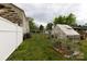 This backyard features a greenhouse for gardening and an area to grow fresh vegetables at 427 Spencer St, Rock Hill, SC 29730