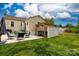 Enjoy a backyard with a hot tub, patio, seating, and a greenhouse for gardening at 427 Spencer St, Rock Hill, SC 29730