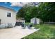 Backyard patio with an umbrella, seating, shed, and hot tub for outdoor enjoyment at 427 Spencer St, Rock Hill, SC 29730
