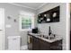 Functional kitchen area featuring a stainless steel sink, granite countertops, and wall decorations at 427 Spencer St, Rock Hill, SC 29730