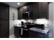 Modern kitchen with stainless steel appliances, granite countertops, and stylish cabinetry at 427 Spencer St, Rock Hill, SC 29730