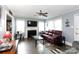 Bright living room with hardwood floors, a fireplace, and a comfortable leather sofa at 427 Spencer St, Rock Hill, SC 29730