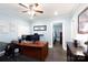 Office featuring a large desk with computer, whiteboard, and view into the bedroom at 427 Spencer St, Rock Hill, SC 29730