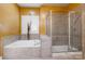 A bathroom features a tiled shower with a glass door, and a soaking tub at 4333 Sawmill Trace Dr, Charlotte, NC 28213