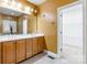 Bathroom vanity offers dual sinks, a big mirror, and a separate room with storage at 4333 Sawmill Trace Dr, Charlotte, NC 28213