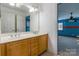 This bathroom has a double sink vanity with light-colored cabinetry at 4333 Sawmill Trace Dr, Charlotte, NC 28213