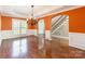Spacious dining room with hardwood floors, natural light, and views of the staircase and foyer at 4333 Sawmill Trace Dr, Charlotte, NC 28213