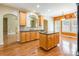Classic kitchen showing sink and island with breakfast bar at 4333 Sawmill Trace Dr, Charlotte, NC 28213