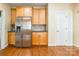 Ample pantry space and a stainless steel refrigerator are the features of this classic kitchen at 4333 Sawmill Trace Dr, Charlotte, NC 28213