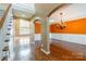 Open-concept space with hardwood floors, archways, staircase, and a decorative chandelier at 4333 Sawmill Trace Dr, Charlotte, NC 28213
