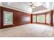 Spacious main bedroom features a tray ceiling, a ceiling fan and neutral carpeting at 4333 Sawmill Trace Dr, Charlotte, NC 28213