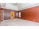 Large main bedroom with carpet, shuttered windows, and a doorway to another room at 4333 Sawmill Trace Dr, Charlotte, NC 28213