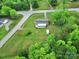 Aerial view of property showcasing a large, well-maintained lawn, house, and storage shed at 4462 Flat Creek Rd, Heath Springs, SC 29058