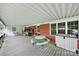 Spacious covered porch with ample seating, perfect for outdoor gatherings and relaxation at 4462 Flat Creek Rd, Heath Springs, SC 29058