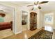 Hallway with hardwood flooring, connecting various rooms, including a bedroom and a sitting area at 4462 Flat Creek Rd, Heath Springs, SC 29058