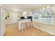 Bright kitchen featuring a breakfast bar with seating and natural light from a large window at 4462 Flat Creek Rd, Heath Springs, SC 29058