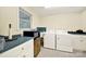 Functional laundry room with white washer and dryer, sink, and countertop space at 4462 Flat Creek Rd, Heath Springs, SC 29058