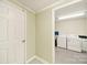 Bright laundry room with appliances and storage, conveniently located near the hallway at 4462 Flat Creek Rd, Heath Springs, SC 29058
