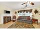 Inviting living area showcasing a fireplace, TV, and vintage accents at 4462 Flat Creek Rd, Heath Springs, SC 29058