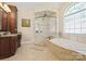 Elegant bathroom featuring a separate shower and jetted tub, and a large vanity at 5016 Woodwinds Ne Dr, Hickory, NC 28601